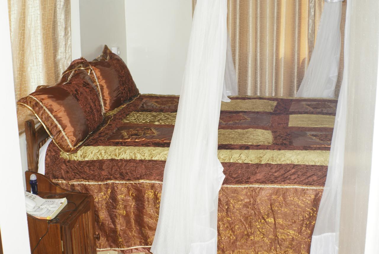 Briston Hotel Аруша Номер фото